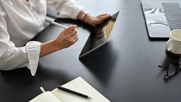 istock Businesswoman using digital tablet touchpad, searching something on online. 1397639640