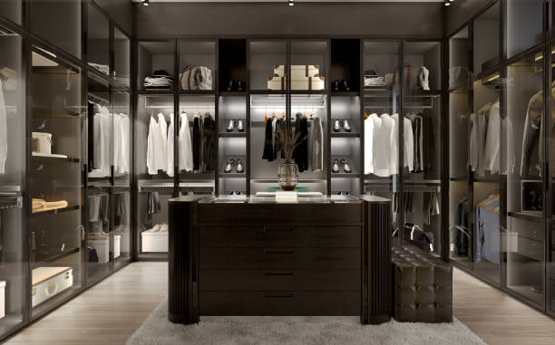istock Modern black wardrobe and lighting with clothes hanging on rail in walk in closet design interior. 3D illustration 1397641430