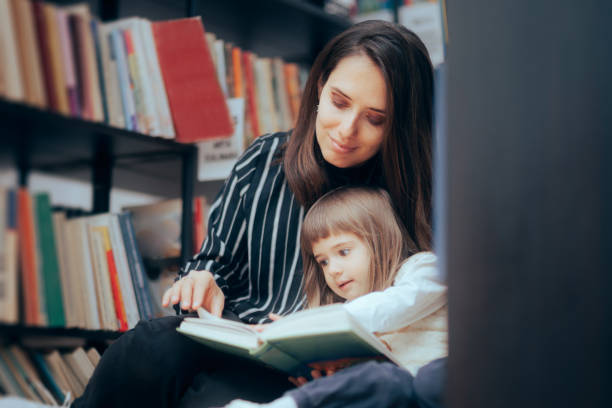 istock Happy Mother and Child Checking a Book at the Library 1397642134