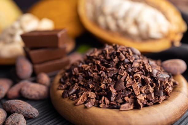 istock cocoa pods, beans and powder on wooden table, top view 1397644399