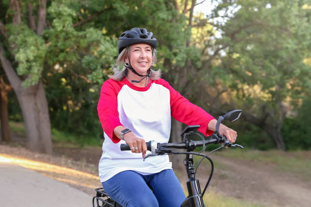 istock Silver haired woman on bike 1397645252