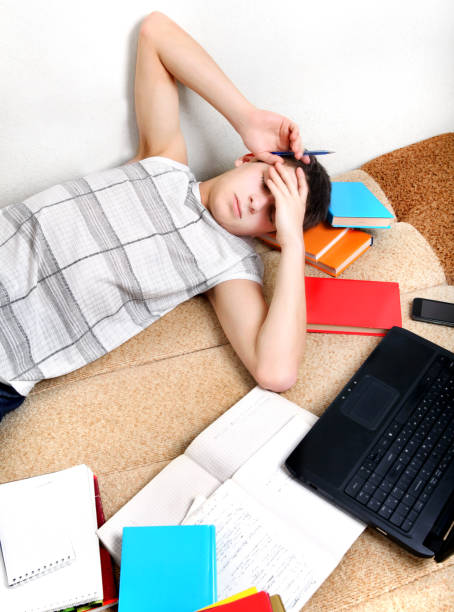 istock Tired Teenager on Sofa 1397649953