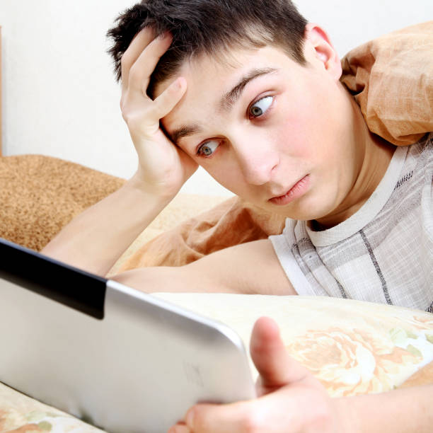 istock Surprised Teenager with Tablet 1397650560