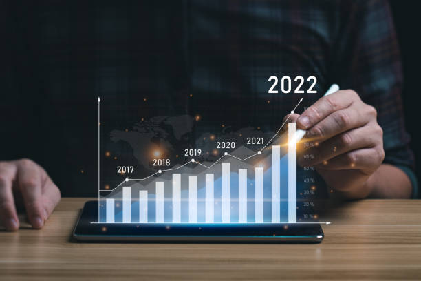 istock Business growth and progress concept. Businessman is showing virtual hologram chart from tablet. plans to increase business growth and an increase in the indicators of positive growth in 2022 1397651794