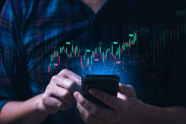 istock Business man or trader showing a virtual trading chart on a smartphone. planning and strategy, Stock market, Business growth, progress or success concept. financial graph bar candlestick 1397651799