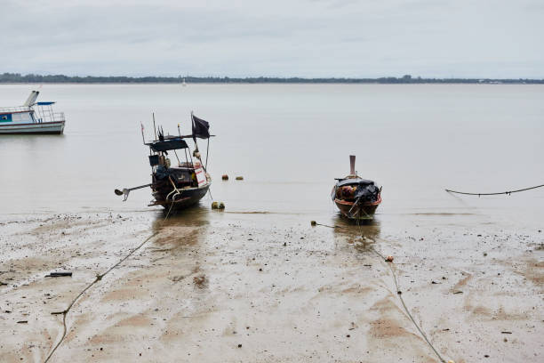istock Fishing boat docking on the beach 1397653503