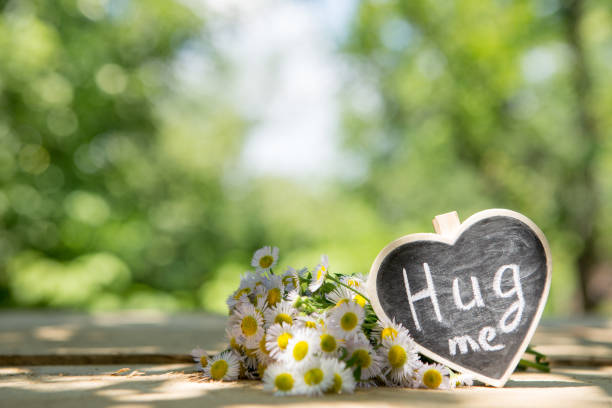 istock Hug me hand drawing phrase on a heart, Sharing a Hug concept 1397655629