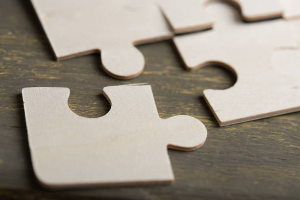 istock Creative solution for idea - business concept, jigsaw puzzle on the wooden desk 1397656208