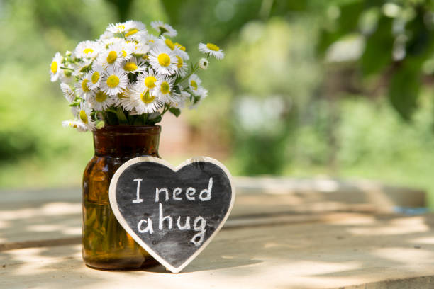 istock I need a hug hand drawing phrase on a heart, Sharing a Hug concept 1397656479