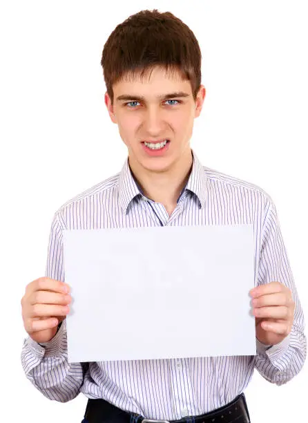 Angry Teenager hold a sheet of Blank Paper Isolated on the White Background