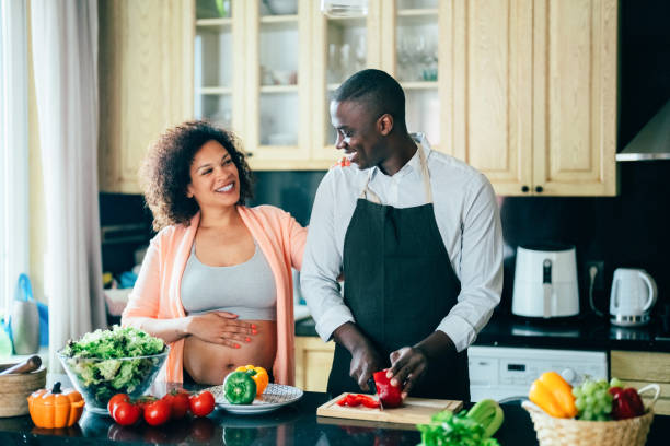 istock Man cooking for his pregnant wife 1397657705