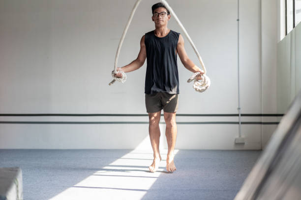 istock Muscular Asian Man Skipping Rope 1397657914