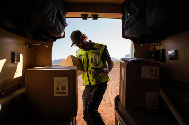istock Delivery man getting packages out of his van 1397658017