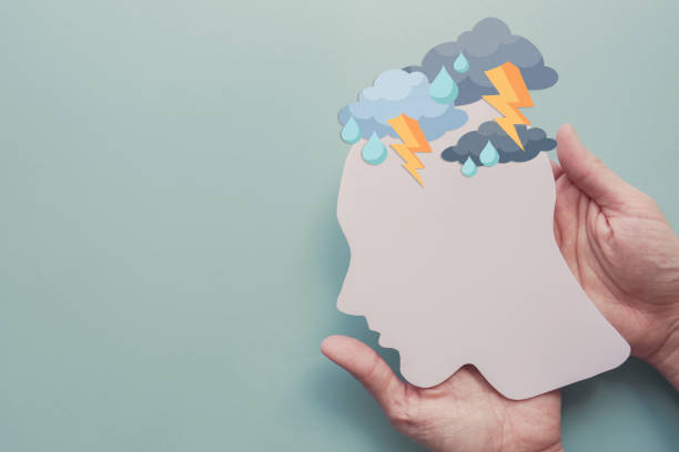 istock Hands holding paper brain thunder storm, mental health, depression, panic attack concept 1397658553