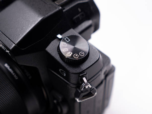 istock Control buttons and control rings on a mirrorless camera close-up view on a white background 1397659085