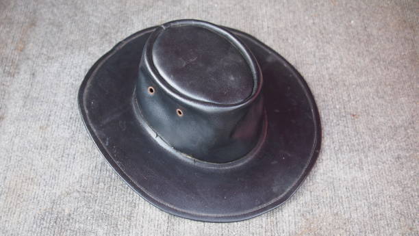 istock Old black leather hat in the trunk of a car 1397661364
