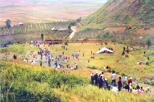 The Zhuanshan Festival (worship mountain day) is the most grand traditional festival of the Mosuo tribe. This mountain is the Gemu Goddess Mountain beside Lugu Lake.Mosuo tribe with traces of maternal clan.Film photo in 08/29/1999,Lugu Lake,Yunnan