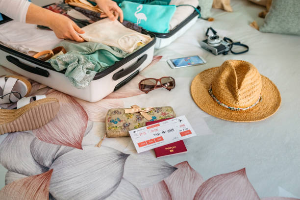 istock Unrecognizable woman preparing suitcase for summer holidays 1397664242