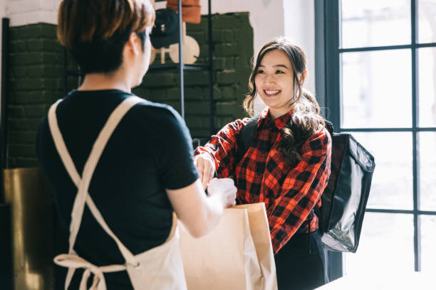 istock Bike courier taking order from pizzeria 1397665081
