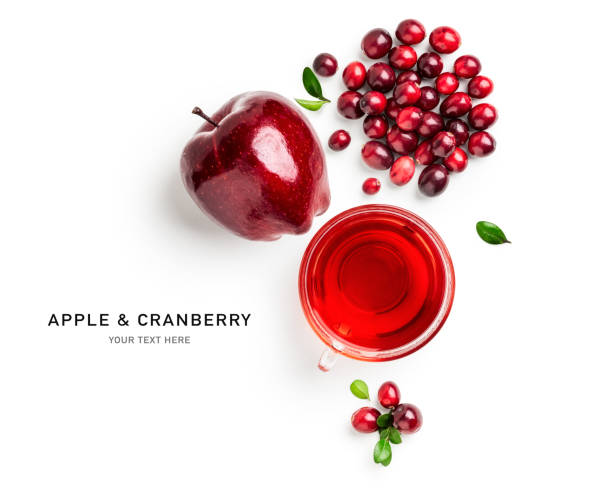 Cranberry and red apple fruit tea creative layout Cranberry and red apple fruit tea. Creative composition and layout with fresh berries isolated on white background. Healthy eating and food concept. Top view, flat lay. Design element cranberry stock pictures, royalty-free photos & images