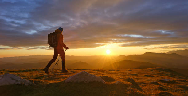 istock Man hiking on top of mountain 1397666803