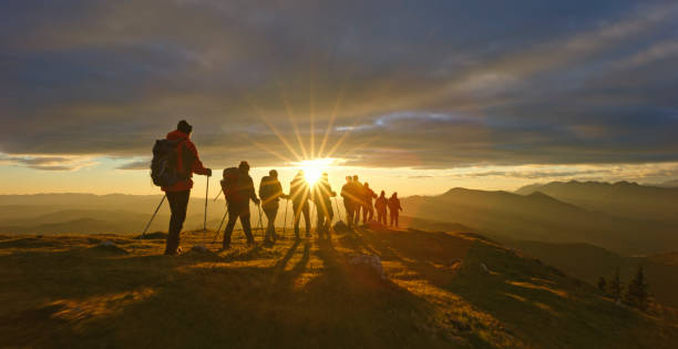 istock Friends hiking on top of mountain 1397666849