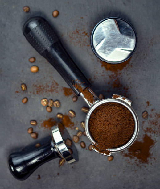 istock Portafilter with coffee bean and temper on concrete table 1397667732
