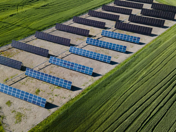 istock Solar Panels in summer field. Aerial Industrial View 1397667803