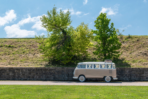 Navarra, Spain. 05/07/2022. Travel with vintage camper van. Camper van parked under some trees looking for shade