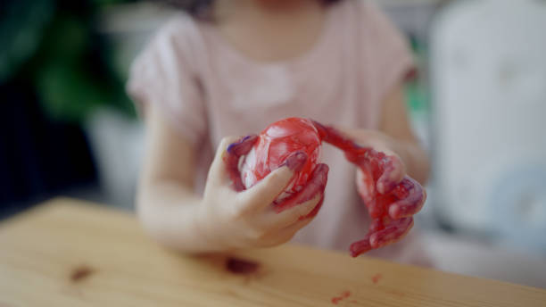 istock Mother and his daughter are painting eggs 1397670063