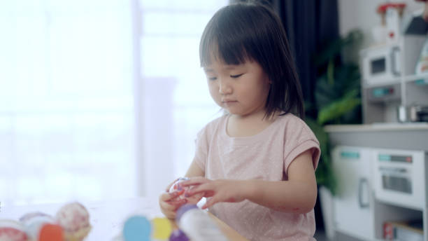 istock Mother and his daughter are painting eggs 1397670096