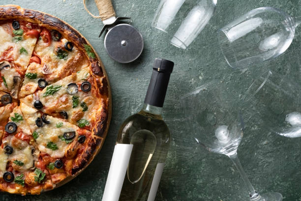 istock Italian cheese and tomato pizza with wine 1397672240