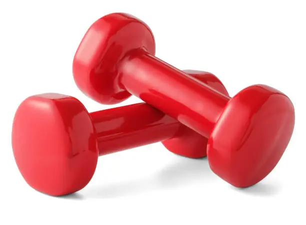 Photo of Red dumbbells isolated