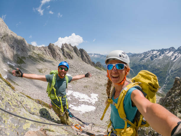 istock Couple taking selfie on Via Ferrata while climbing, summer outdoor sport activity 1397673280