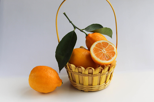 wicker basket with ripe lemons