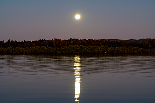Full Moon rising just after the sun set at Woy Woy on the Central Coast of NSW, Australia.