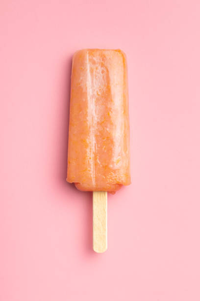 istock Fruity ice lolly. Sweet popsicle on pink table. 1397674940