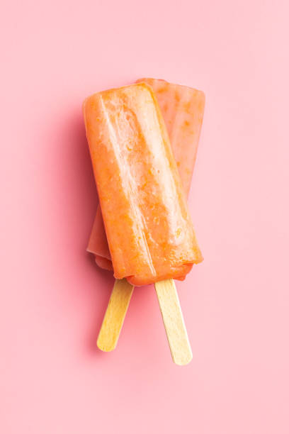 istock Fruity ice lolly. Sweet popsicle on pink table. 1397674965