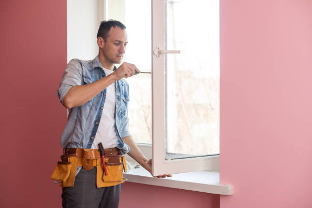istock The worker installing and checking window in the house. 1397674973