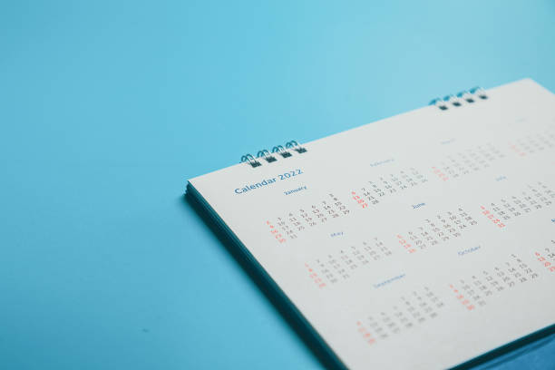 istock Close top view on white calendar 2022 month schedule Work planning and life concept. 1397675571