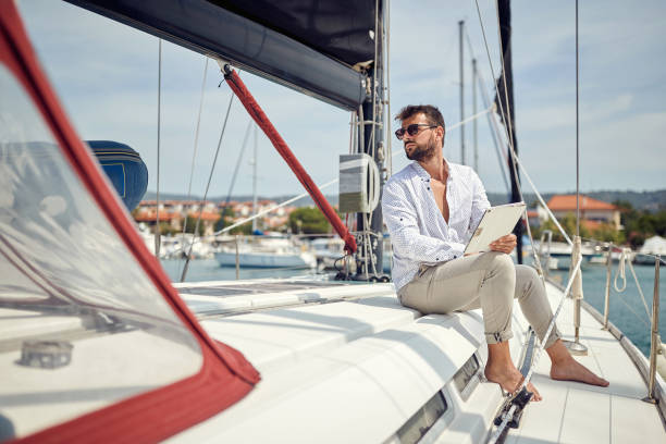 istock Spontaneous businessman working on the yacht 1397676188