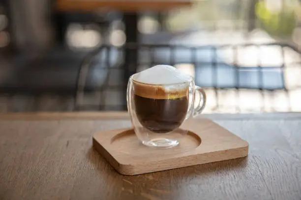 hot macchiato coffee on the cafe table