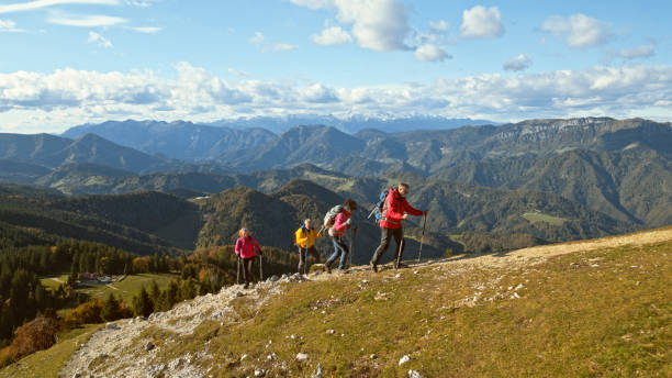 istock Friends hiking on mountain 1397678684