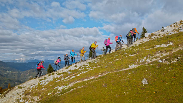 istock Friends hiking on mountain 1397678694