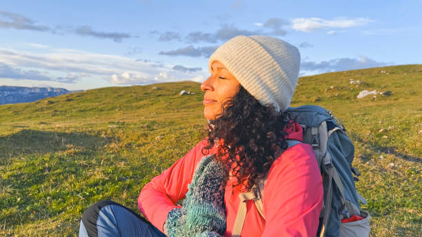 istock Mature woman mediating with her eyes closed 1397678709