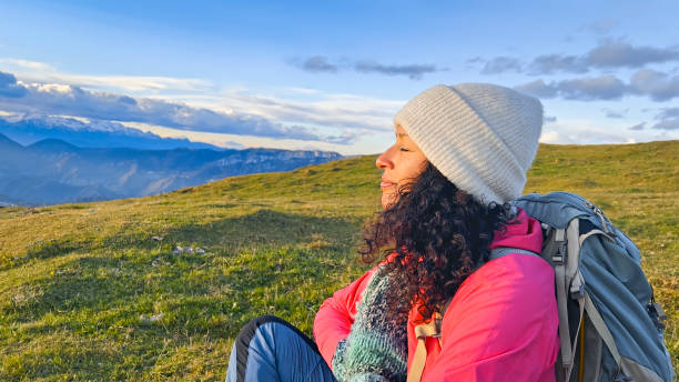 istock Mature woman mediating with her eyes closed 1397678723
