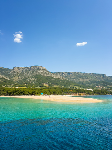 Famous beach Zlatni rat (Golden Horn or Golden Cape), Bol, Brac island, Dalmatia, Croatia, Europe. View from sailboat.