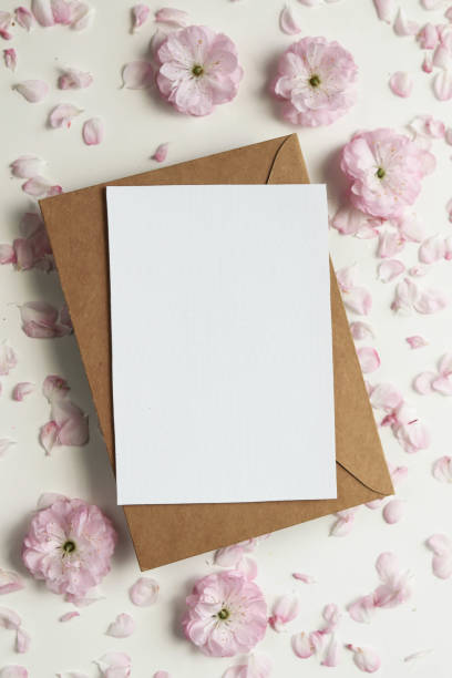 istock postcard mockup. frame of flowers and white blank for text 1397680679