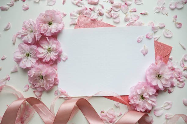 istock postcard mockup. frame of flowers and white blank for text 1397680718