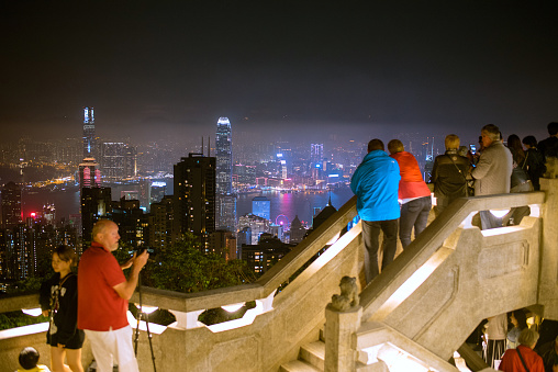 Hong Kong Island, Hong Kong - December 6, 2018: Hong Kong skyline and tourist at Victoria Peak at night.